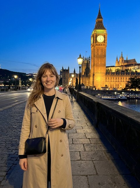 With LikeThis: same framing, tower behind her